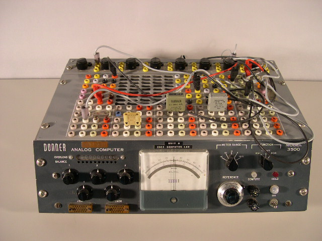 Front and top view of the Donner 3500 analog computer.  The wires (called patchcords) were used to program the computer; imagine substituting that wiring process for the modern keyboard.